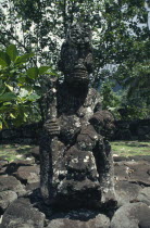 Marquesas  Nuku Hiva.  Stone Tiki carved figure.
