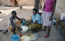 Girls stirring milk.