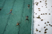 People swimming lengths in Luca thermal baths.