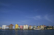Willemstad.  Colourful waterfront buildings and moored sailing ship. Colorful