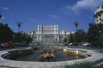 House of the Republic.  Palace of former Communist president Nicholae Ceausescu.  Exterior facade with pool and fountain in the foreground.