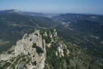 Peyrepertuse Cathar Castle.  Ruined fortifications of eleventh century castle on rocky hillside.