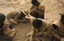 Dust covered group of gold miners. West Africa