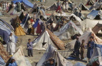 UNHCR camp for refugees from Afghanistan.  Crowded tents  men  women and children.United Nations High Commissioner for Refugees