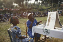 Women giving outdoor family planning lecture