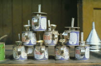 Nestle evaporated milk cans made into oil lamps.recyclerecycling
