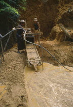 Gold miners panning for gold.