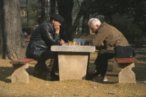 Chess players in park.