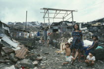 Family on Smoky Mountain slum