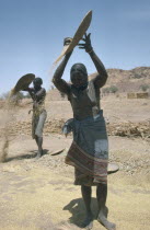 Maslit tribeswomen winnowing millet.Semi nomadic non arab group.