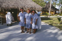 Ringiroa.  Women workers in hotel complex.