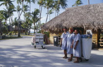 Ringiroa.  Women workers in hotel complex.