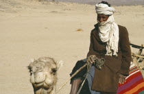 Cropped view of Tuareg man riding camel.Nomadic people of Berber origin toureg