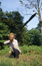 Dayak hunter with blowpipe