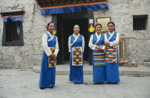 Tibetan women standing outside the Folk Culture Villages Theme Park