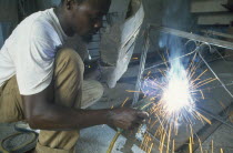 Justin Kimaru an Oxfam adied trainee electric arc welding.
