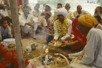 Puja meaning respect offering or prayers forming part of a memorial service for a recently deceased man.