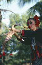 Dancer of Phu Thai tribe with long stalked flowers on her fingers