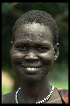 Portrait of a smiling Neuer girl with facial scarification