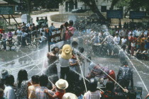 Thingyan Buddhist Water Festival.  Crowds spraying water from hoses. Burma Myanmar