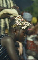 Woman with head dress made of shells