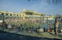 Szechenyi Thermal Baths.  Open air swimming pools with crowds of bathers at medicinal baths.