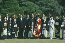 Formal portrait of Shinto wedding group.