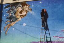 Painter working on mural based on Botticelli painting of Venus.