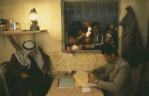 PLO camp or Gamstation.  Boys looking through barred window.