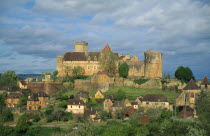 Castelnau-Bretenoux Castle above hillside town.