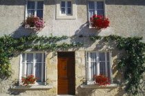 House ifacade with hanging baskets in Bastide town