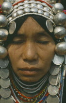 Akha Tribeswoman. Cropped head and shoulders portrait.