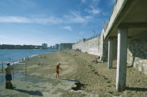 Old Portsmouth. Occupied strectch of beach next to the Walls looking towards the Square Tower.