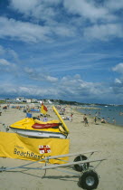 Lifeboats Beach Rescue banner and Jetski on sandy beach.