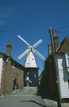 Road leading to Windmill with houses either side.