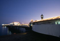 England, East Sussex, Brighton, Pier illuminated at night.
