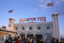 England, East Sussex, Brighton, Pier sign illuminated at night.