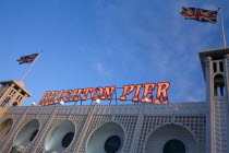 England, East Sussex, Brighton, pier sign illuminated at night.