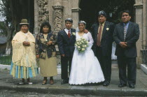 Wedding in El Monticulo. Bride  Groom and guests standing outside.