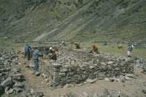 Local Quechuan men building a house. Cuzco  Sacred Valley  Andes Cuzco  Sacred Valley  Andes