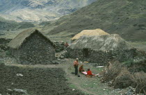 Local Quechuan people weaving in front of dwelling.Cuzco  Sacred Valley  AndesCuzco  Sacred Valley  Andes