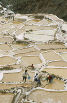 People working on the Salt Mines dating back to Inca times. Near Urubamba.