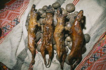 Cancha Cancha. Detail of cooked guinea pig and potatoes  traditional Andean food. Cuzco  Cuzco