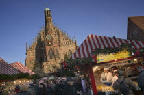 The Christmas Market in Hauptmarkt with The Frauenkirche behind.Nurnberg  Christkindlesmarkt  Festive  Advent  Yuletide  Travel  Holidays