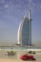 Jet skis on Umm Suqeim Public Beach with The Burj Al Arab Hotel in the background.Middle East  Sun bathing  Seaside  Holidays  Tourism Travel  Luxury  Dubayy Dubai United Arab Emirates