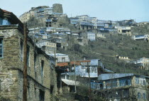 Village housing on steep hillside.