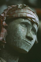 Face detail of Toraja wooden funeral effigy or Tau Tau placed outside the grave to represent the spirit of the deceased.