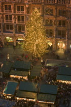 The Christmas tree and stalls in front of the Rathaus during the Christmas Market.Christkindlesmarkt  FestiveAdventYuletideTravelHolidaysChristmas TreeFairy Lights