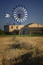 Farm with windmills near Palma de Mallorca.MajorcaMediterraneanTravelTourismHolidaysHarvestMolins de CamposAgricultureFarmingWindmill. Wind Power