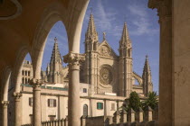 Palma de Mallorca  View of the Cathedral from under a row of arches.MajorcaCatedralTravelTourismHolidaysMediterraneanArchitecture